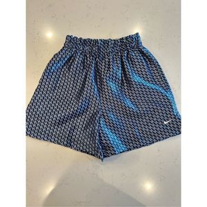 Vintage women’s Nike silky satin athletic “boxer” shorts blue printed medium